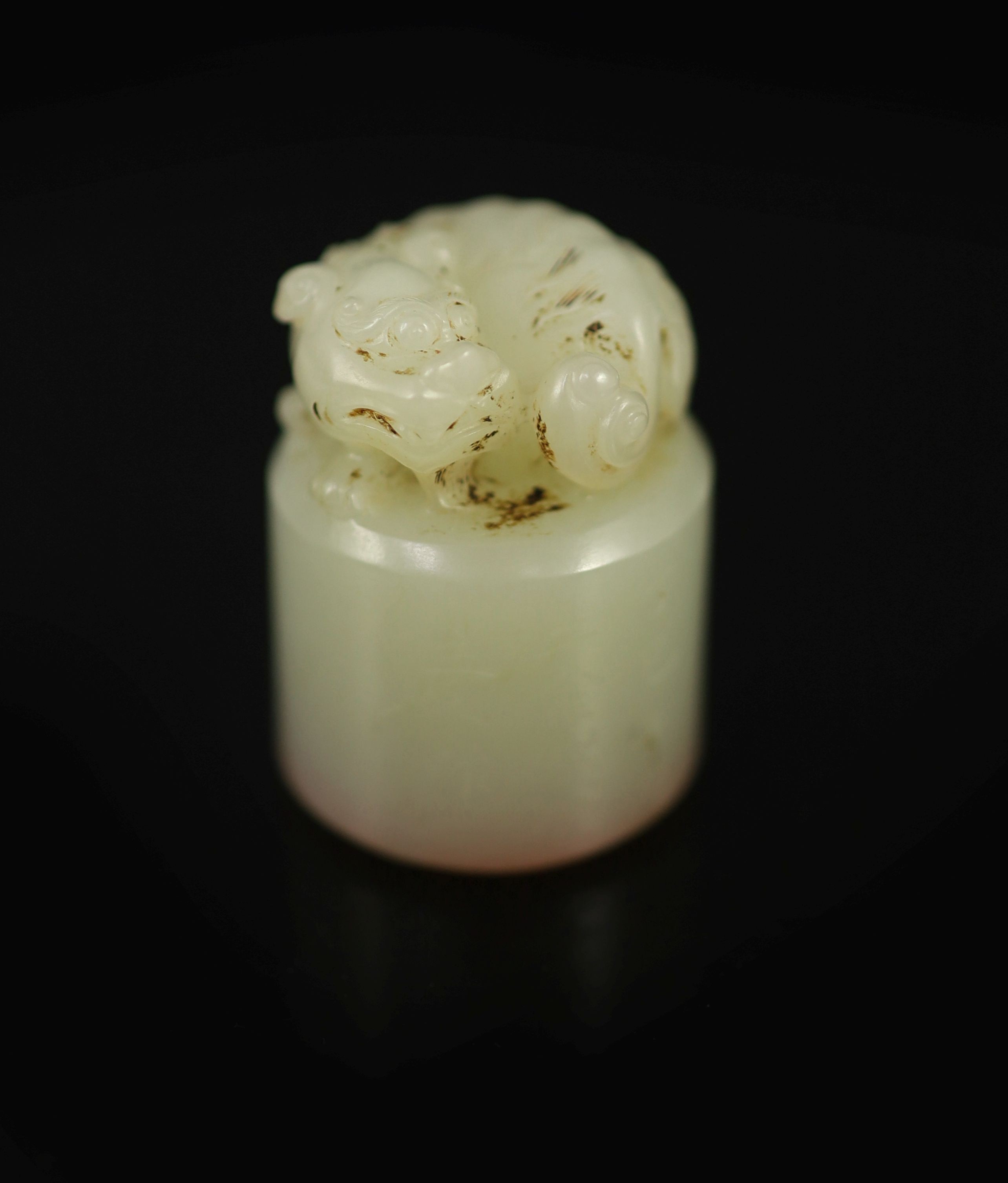 A Chinese white jade cylindrical seal, 3.5 cm high